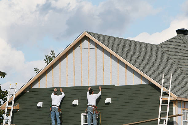 Professional Siding technician working in Apex, NC